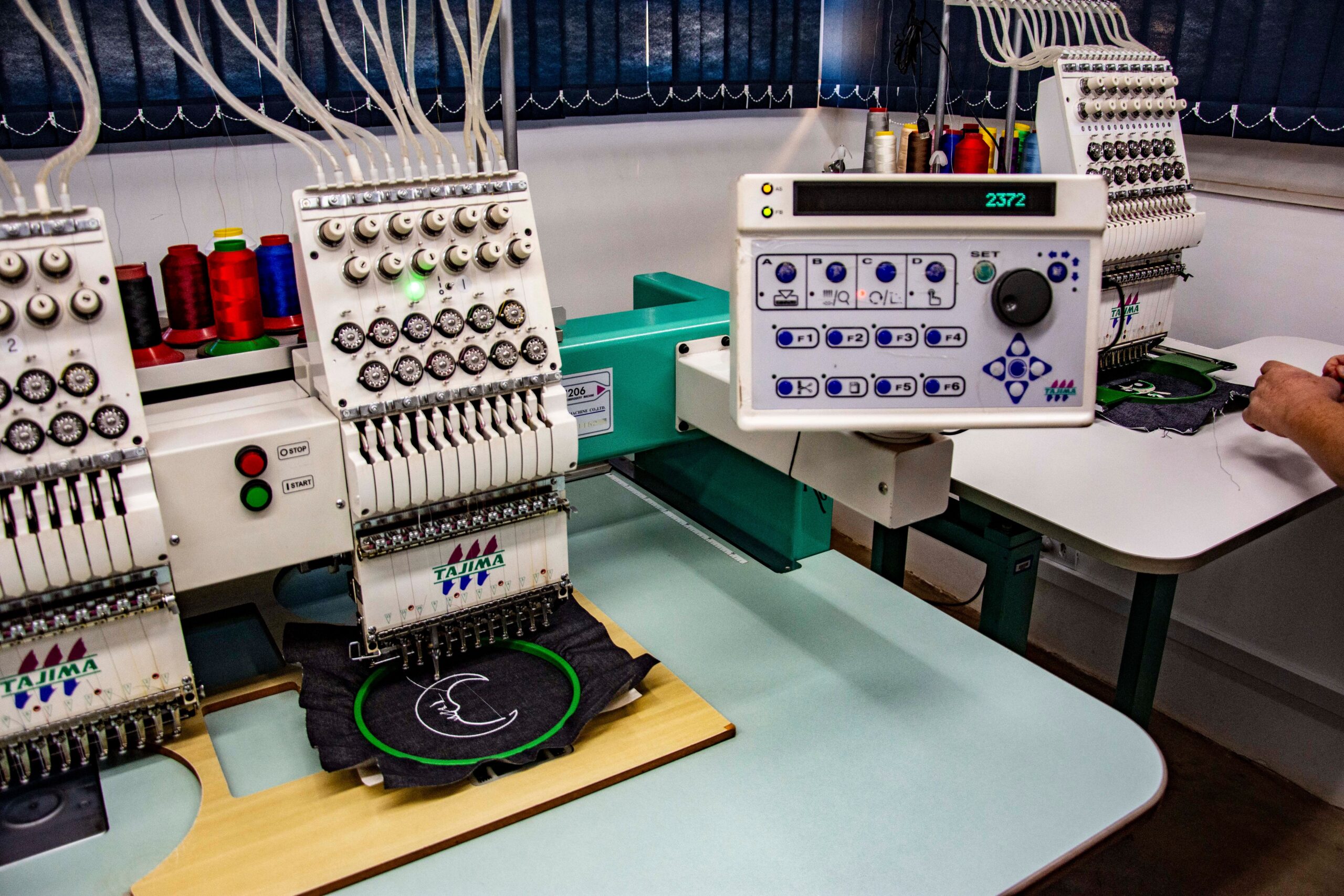 Services Detailed view of embroidery machines used in a textile workshop in Apucarana, Brazil.